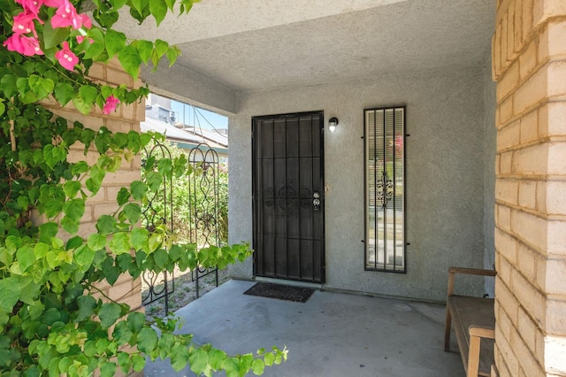 2063 S Tupman Ave, Fresno, CA 93706 - doorway to property with stucco siding and a patio