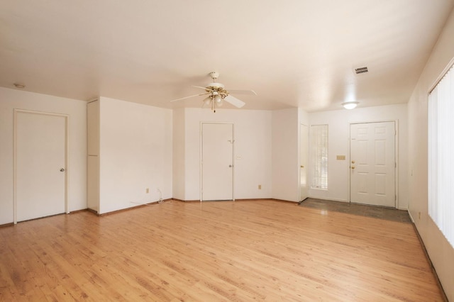 2063 S Tupman Ave, Fresno, CA 93706 - empty room with light wood finished floors and ceiling fan