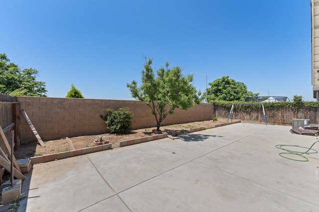 fenced backyard with a patio area