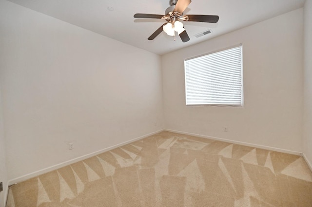 empty room with light carpet, baseboards, and ceiling fan