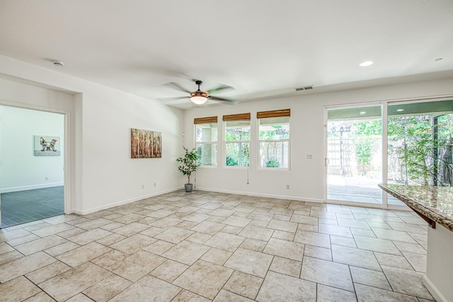 unfurnished room with a ceiling fan, baseboards, and recessed lighting