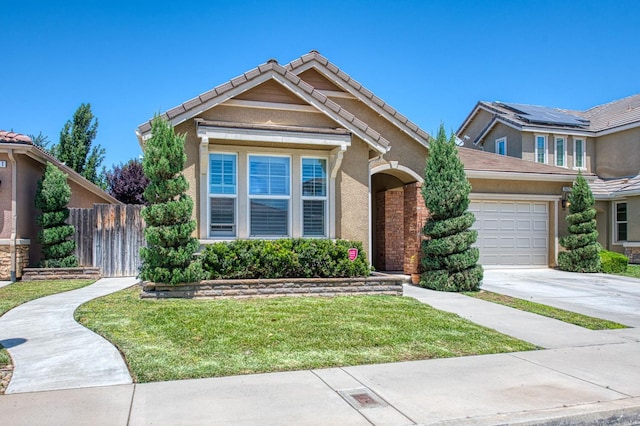 view of front of property featuring concrete driveway, an attached garage, and stucco siding