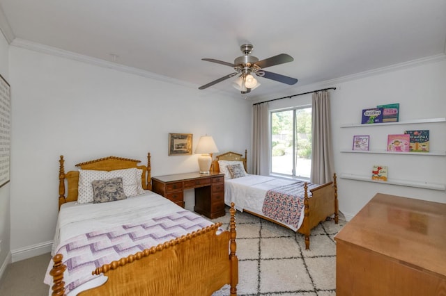 bedroom featuring crown molding, baseboards, a ceiling fan, and carpet floors