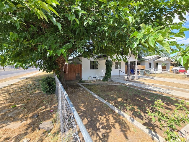 view of front of home featuring a porch and stucco siding
