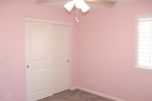 1884 Clover, Dinuba, CA 93618 - unfurnished bedroom featuring light carpet, a closet, a ceiling fan, and baseboards