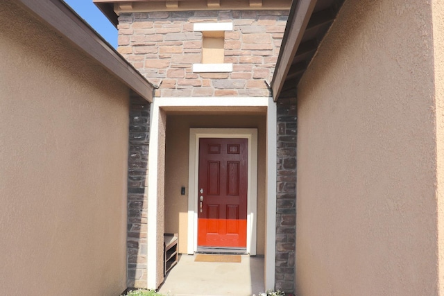 1884 Clover, Dinuba, CA 93618 - property entrance featuring stucco siding and stone siding