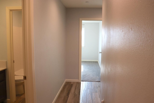 1884 Clover, Dinuba, CA 93618 - hallway with wood finished floors and baseboards