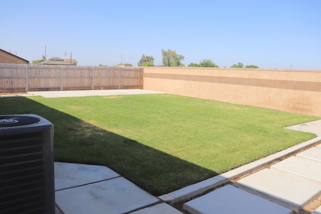 1884 Clover, Dinuba, CA 93618 - view of yard with central air condition unit and a patio area