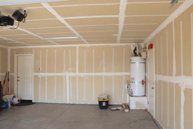 1884 Clover, Dinuba, CA 93618 - garage featuring strapped water heater and a garage door opener