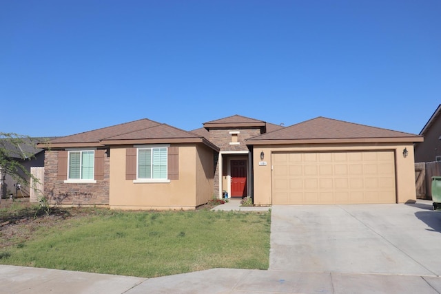1884 Clover, Dinuba, CA 93618 - view of front facade with an attached garage, concrete driveway, stucco siding, and stone siding