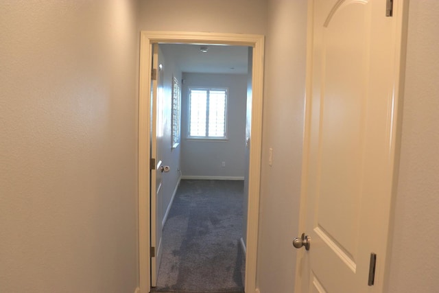 1884 Clover, Dinuba, CA 93618 - hall with dark colored carpet and baseboards