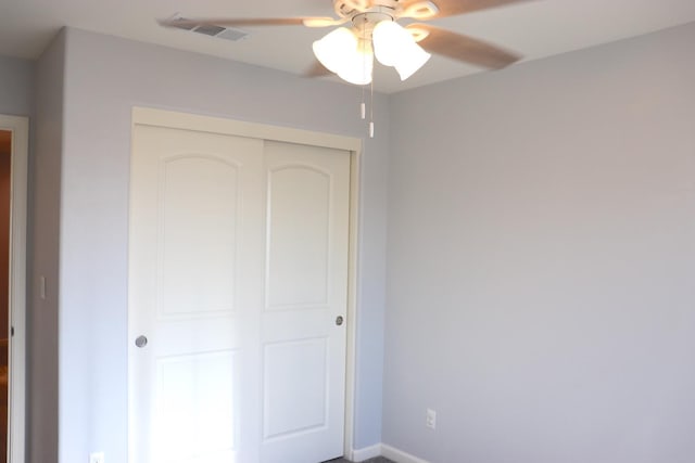 1884 Clover, Dinuba, CA 93618 - unfurnished bedroom with a closet, baseboards, and ceiling fan