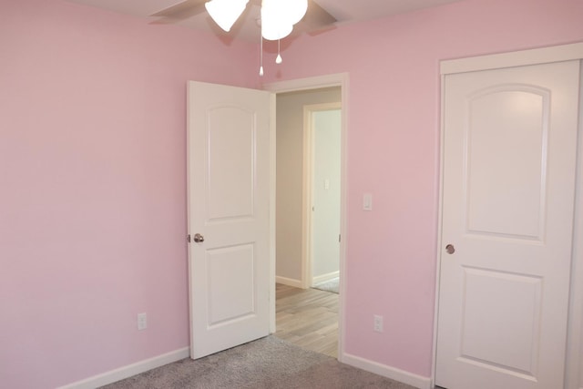 1884 Clover, Dinuba, CA 93618 - unfurnished bedroom featuring baseboards, light carpet, and ceiling fan