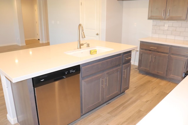 1884 Clover, Dinuba, CA 93618 - kitchen with dishwasher, a sink, light wood finished floors, light countertops, and tasteful backsplash