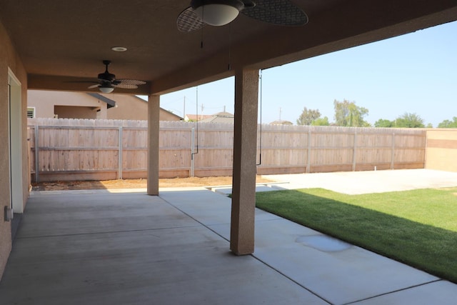 1884 Clover, Dinuba, CA 93618 - fenced backyard with a ceiling fan and a patio area