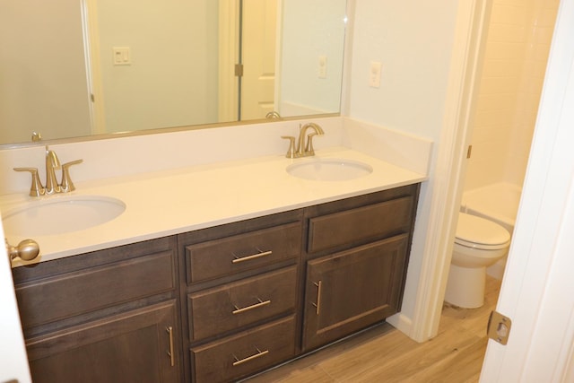 1884 Clover, Dinuba, CA 93618 - bathroom featuring wood finished floors, double vanity, and toilet