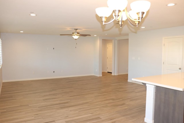 1884 Clover, Dinuba, CA 93618 - empty room featuring recessed lighting, ceiling fan, light wood-style floors, a chandelier, and baseboards