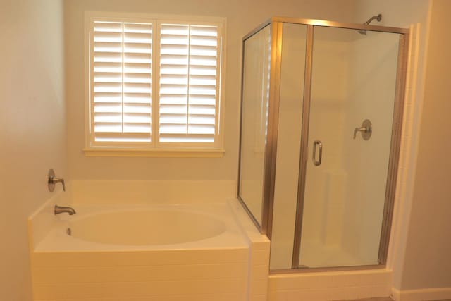 1884 Clover, Dinuba, CA 93618 - bathroom with a shower stall and a bath