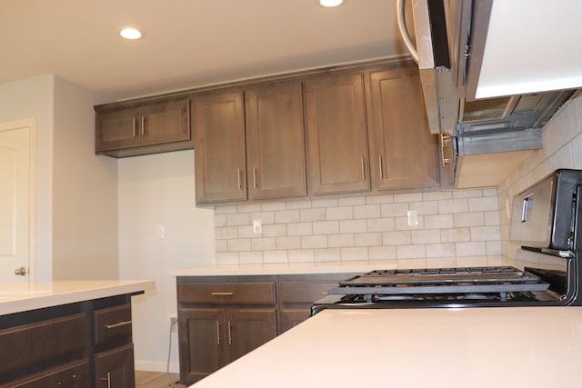 1884 Clover, Dinuba, CA 93618 - kitchen with light countertops, tasteful backsplash, recessed lighting, and dark brown cabinets