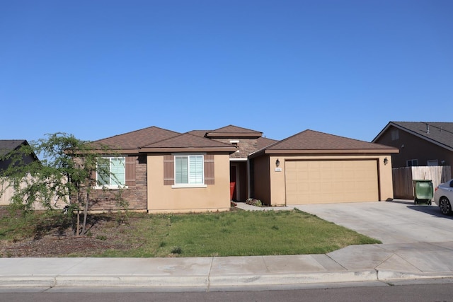 1884 Clover, Dinuba, CA 93618 - view of front of property featuring an attached garage, driveway, stucco siding, and stone siding