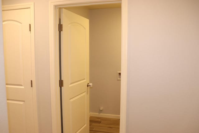 1884 Clover, Dinuba, CA 93618 - hallway featuring wood finished floors and baseboards