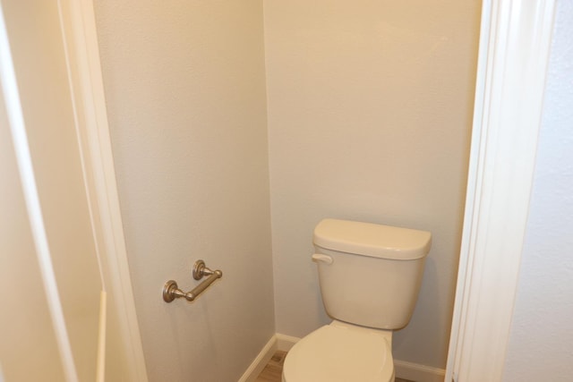 1884 Clover, Dinuba, CA 93618 - bathroom featuring toilet and baseboards