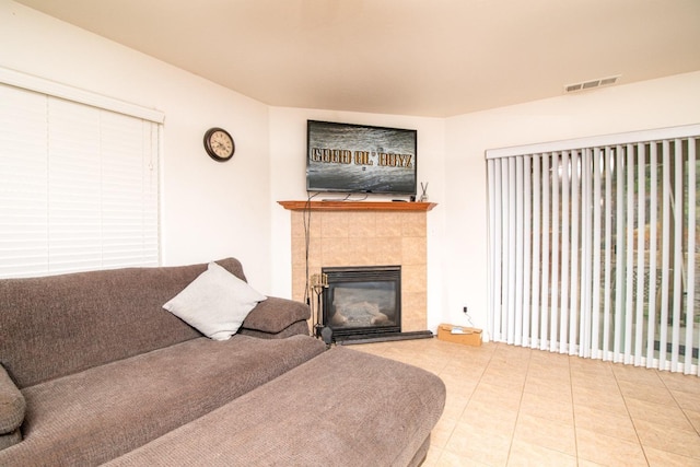 45704 Butternut Ln, Yokuts Valley, CA 93675 - living room featuring a tiled fireplace and tile patterned flooring