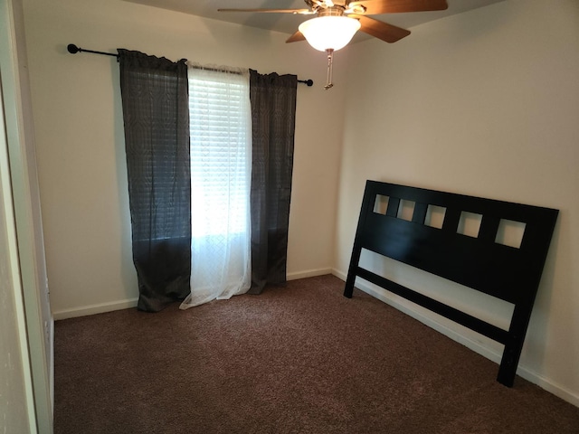 45704 Butternut Ln, Yokuts Valley, CA 93675 - unfurnished bedroom with carpet floors, baseboards, and ceiling fan