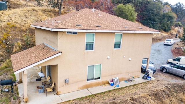 45704 Butternut Ln, Yokuts Valley, CA 93675 - rear view of property with stucco siding, a patio, and a shingled roof