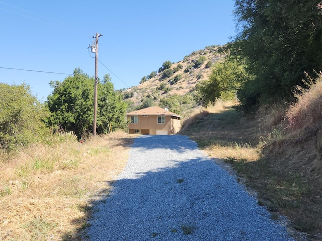 45704 Butternut Ln, Yokuts Valley, CA 93675 - view of dirt / gravel road with a mountain view