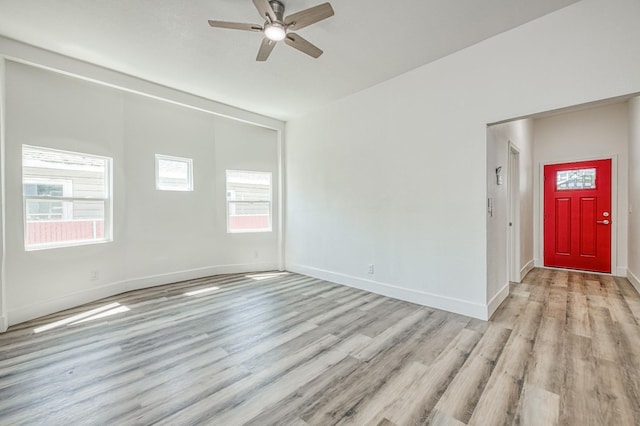 604 N Poplar Ave, Fresno, CA 93728 - unfurnished room with light wood-style floors, a ceiling fan, and baseboards