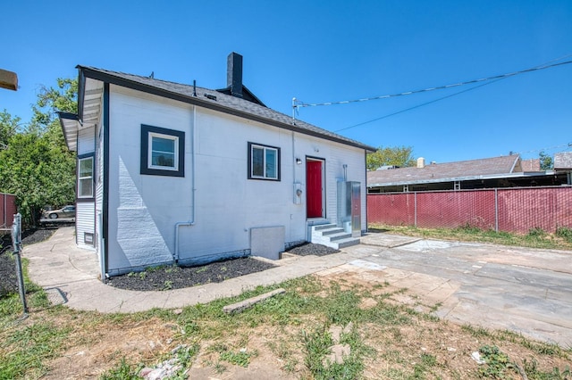 604 N Poplar Ave, Fresno, CA 93728 - back of house with entry steps and a chimney