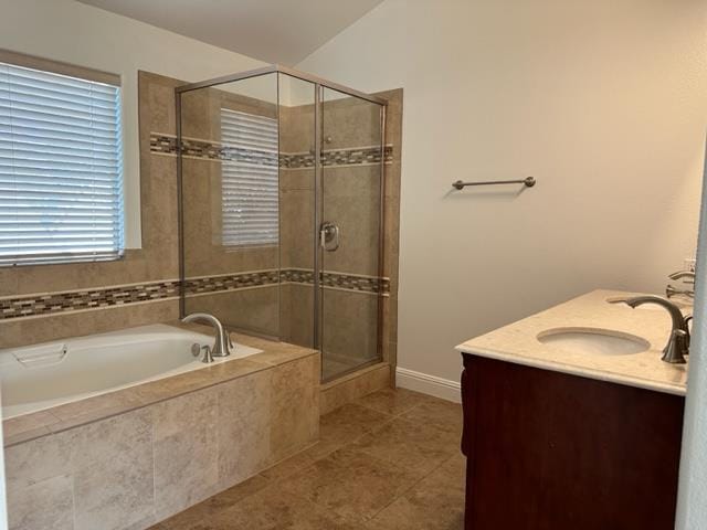 10752 N Windham Bay Cir, Fresno, CA 93730 - bathroom featuring a stall shower, a garden tub, tile patterned floors, and double vanity