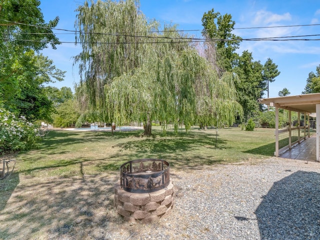 12502 Rd 37 Unit 1/2, Madera, CA 93636 - view of grassy yard with a fire pit