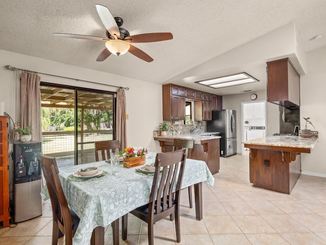 12502 Rd 37 Unit 1/2, Madera, CA 93636 - dining space featuring washer / clothes dryer, light tile patterned floors, a textured ceiling, and a ceiling fan