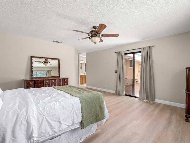 12502 Rd 37 Unit 1/2, Madera, CA 93636 - bedroom featuring light wood-style flooring, access to exterior, a textured ceiling, baseboards, and ceiling fan