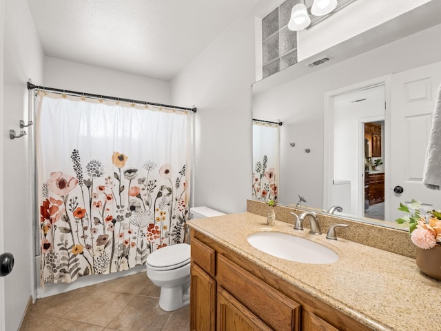 12502 Rd 37 Unit 1/2, Madera, CA 93636 - full bathroom with toilet, tile patterned floors, vanity, and a shower with shower curtain