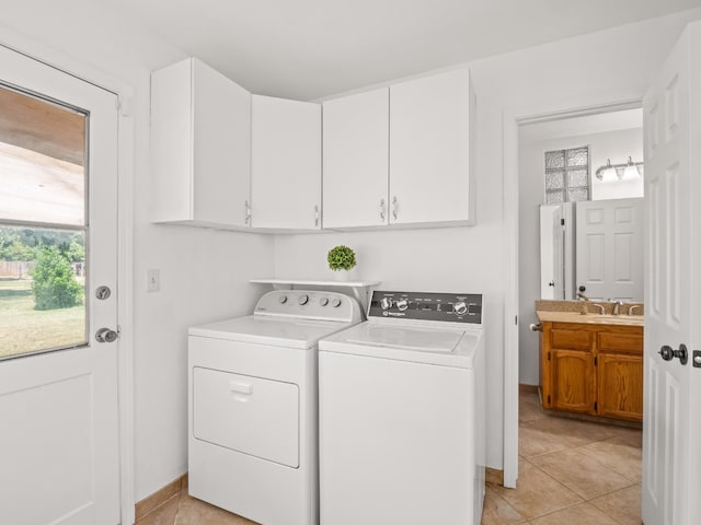 12502 Rd 37 Unit 1/2, Madera, CA 93636 - washroom featuring independent washer and dryer, light tile patterned flooring, and cabinet space