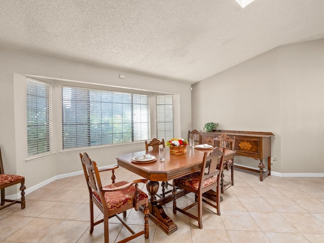 12502 Rd 37 Unit 1/2, Madera, CA 93636 - dining space with a textured ceiling, light tile patterned flooring, and baseboards