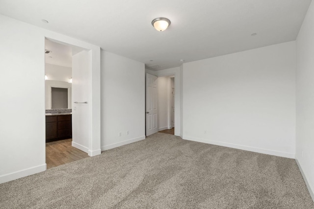 3822 Hannah Ln, Clovis, CA 93619 - unfurnished bedroom with light colored carpet, baseboards, and ensuite bathroom