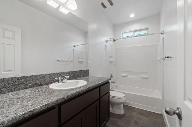 3822 Hannah Ln, Clovis, CA 93619 - bathroom with wood finished floors, toilet, washtub / shower combination, and vanity