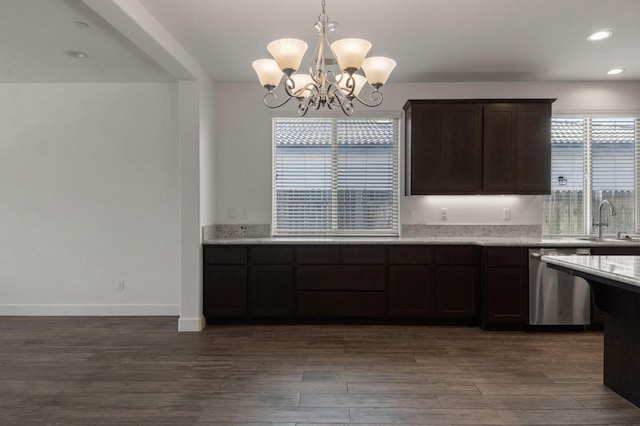 3822 Hannah Ln, Clovis, CA 93619 - kitchen with dishwasher, a chandelier, a sink, dark brown cabinets, and wood finished floors