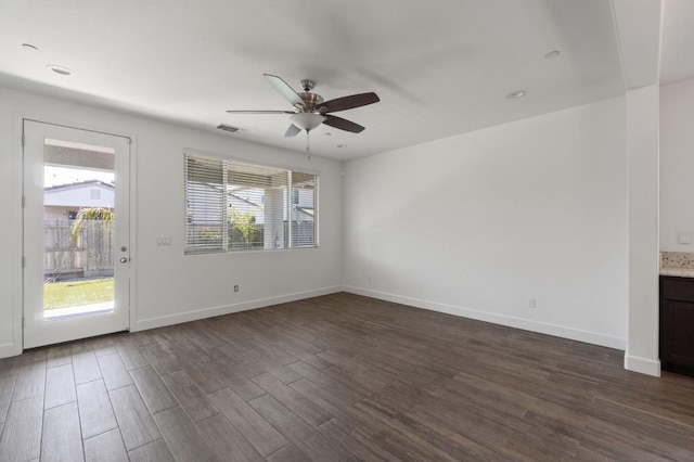 3822 Hannah Ln, Clovis, CA 93619 - unfurnished living room featuring ceiling fan, dark wood finished floors, and baseboards