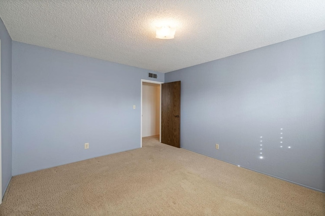 1322 W Millbrae Ave, Fresno, CA 93711 - empty room featuring carpet floors and a textured ceiling