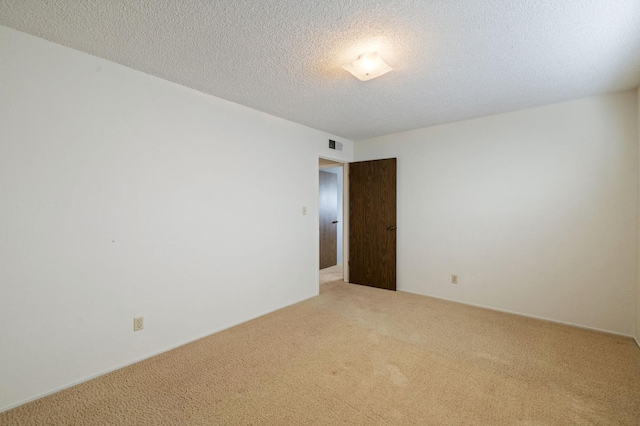 1322 W Millbrae Ave, Fresno, CA 93711 - carpeted spare room with a textured ceiling