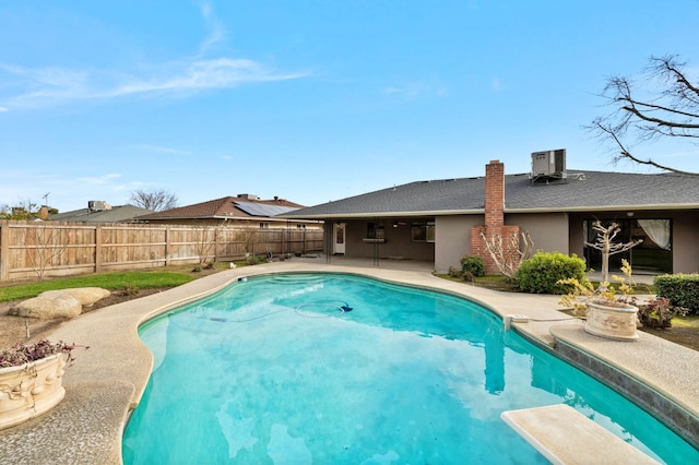 1322 W Millbrae Ave, Fresno, CA 93711 - view of swimming pool with a patio, a fenced backyard, a diving board, and central AC
