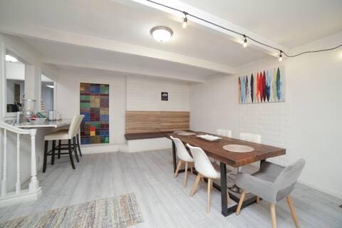 5543 N 7th St, Fresno, CA 93710 - dining space featuring wood finished floors, beam ceiling, and track lighting