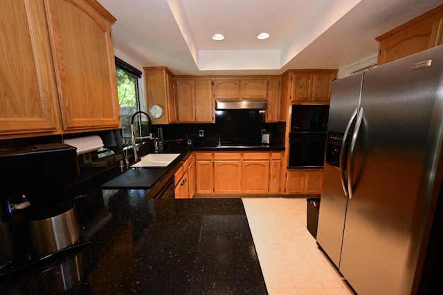 6340 N Gilroy Ave, Fresno, CA 93722 - kitchen with black appliances, under cabinet range hood, a sink, recessed lighting, and dark stone counters