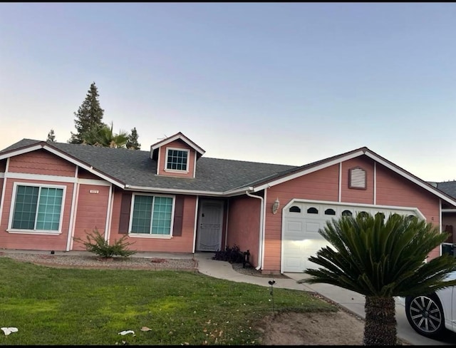 5323 W Garland Ave, Fresno, CA 93722 - view of front facade featuring an attached garage, a front yard, and roof with shingles