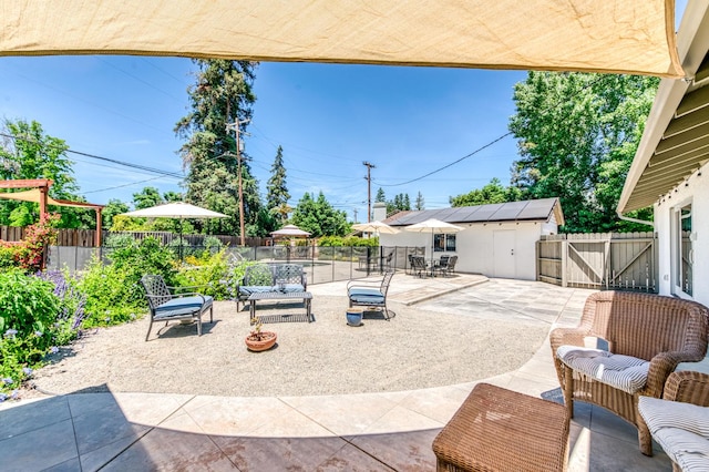 5669 N Arthur Ave, Fresno, CA 93711 - fenced backyard with a patio, outdoor dining space, and an outdoor structure